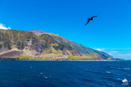 Tristan da Cunha are the most remote islands of the British Overseas Territories. Nestled in the South Atlantic, the volcanic lands are home to fewer than 300 people. Considered the most remote populated island group on Earth, Tristan da Cunha is only reachable by water from Cape Town at a distance of 2787 kilometers (1732 miles). The island is so remote that only three ships travel there nine times a year